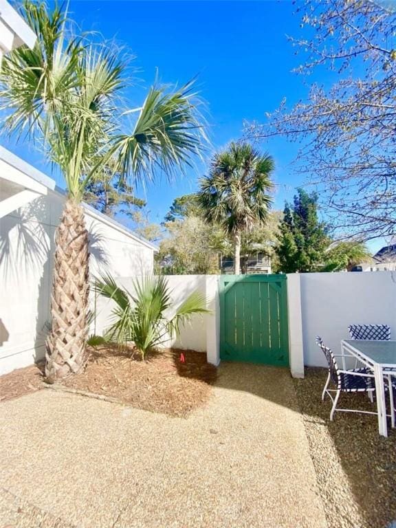 view of gate with fence