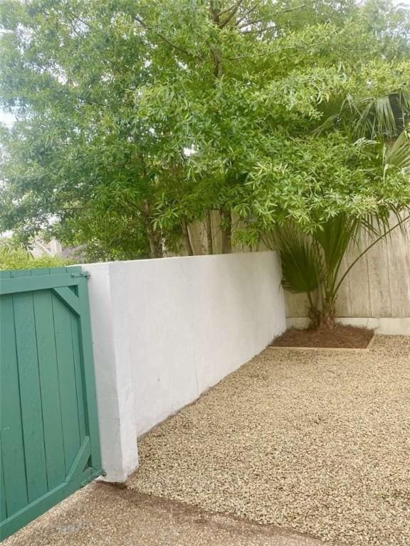 exterior space with a gate and fence