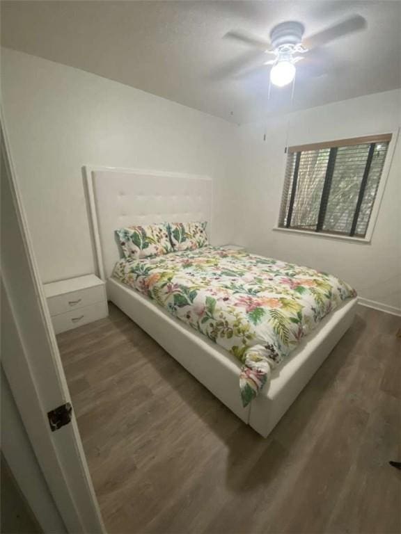 bedroom featuring ceiling fan and wood finished floors