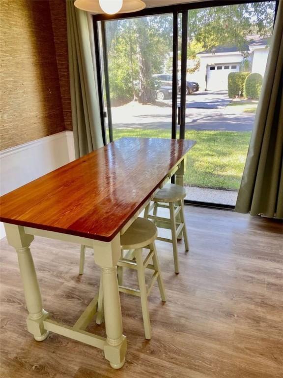 unfurnished dining area with wood finished floors