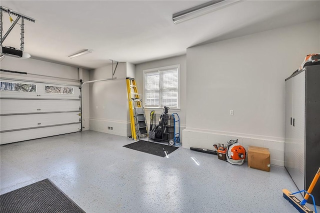 garage featuring a garage door opener