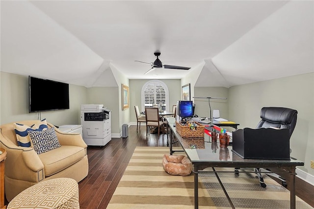 office space featuring lofted ceiling, wood finished floors, and baseboards