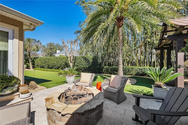 view of patio with an outdoor fire pit