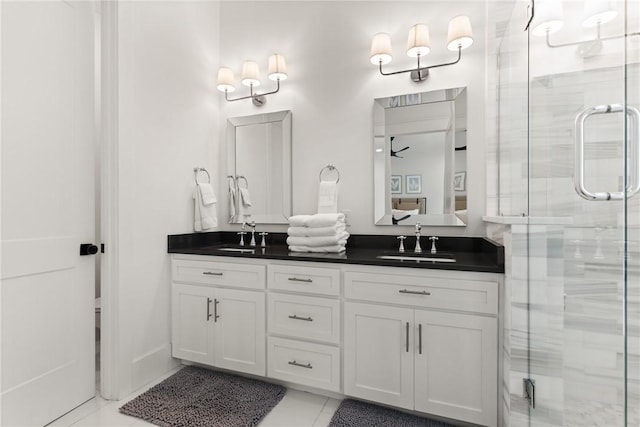 1153 Ocean Blvd, Saint Simons Island, GA 31522 - bathroom with double vanity, a shower stall, and tile patterned flooring