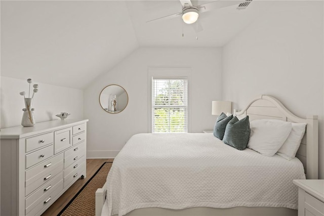 1153 Ocean Blvd, Saint Simons Island, GA 31522 - bedroom with dark wood-type flooring, vaulted ceiling, and ceiling fan