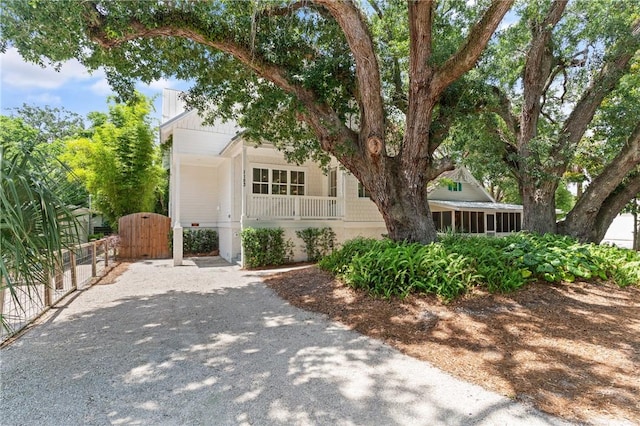 1153 Ocean Blvd, Saint Simons Island, GA 31522 - view of front of home featuring a gate