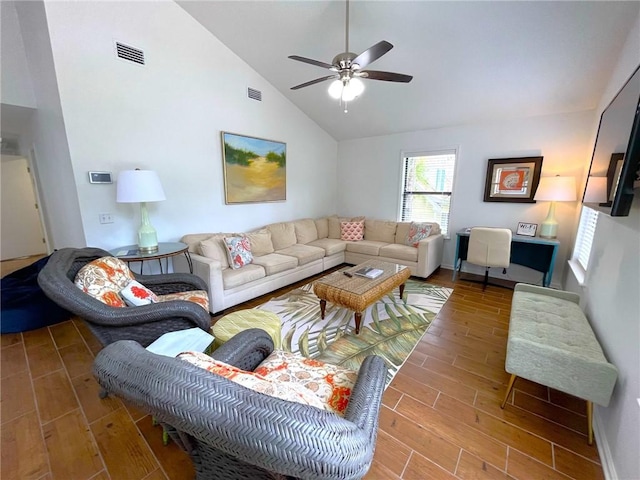 living room featuring ceiling fan, high vaulted ceiling, and wood-type flooring