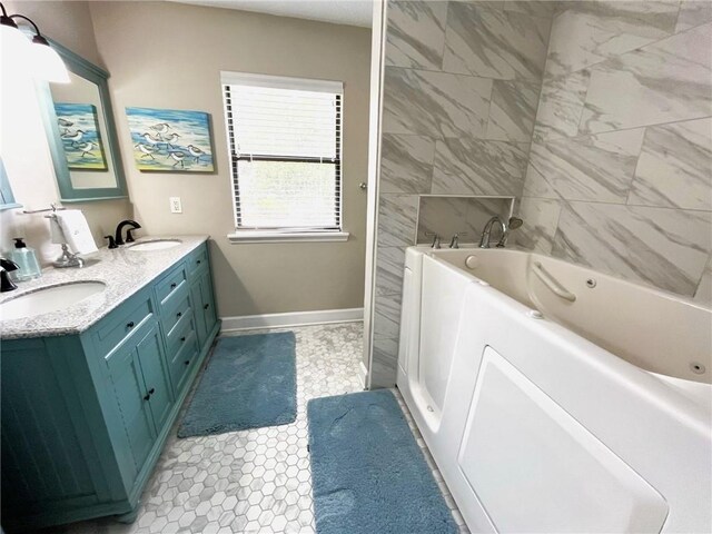 bathroom with tile patterned flooring, vanity, and a washtub