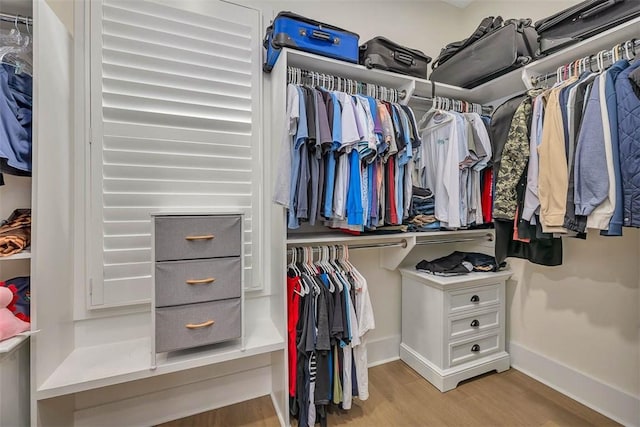 147 Butler Lake Dr, Saint Simons Island, GA 31522 - walk in closet featuring wood finished floors