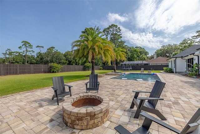 147 Butler Lake Dr, Saint Simons Island, GA 31522 - view of pool featuring a fire pit, a fenced backyard, a patio, and a pool with connected hot tub