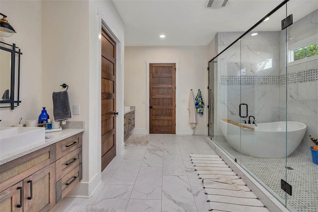 147 Butler Lake Dr, Saint Simons Island, GA 31522 - full bathroom featuring marble finish floors, vanity, a freestanding bath, a shower stall, and recessed lighting