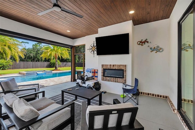 147 Butler Lake Dr, Saint Simons Island, GA 31522 - fenced backyard featuring a pool with connected hot tub, an outdoor living space with a fireplace, ceiling fan, and a patio