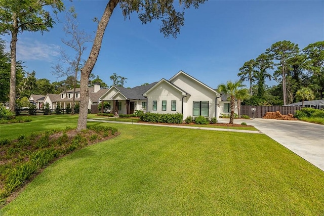 147 Butler Lake Dr, Saint Simons Island, GA 31522 - view of front of home featuring stucco siding and concrete driveway
