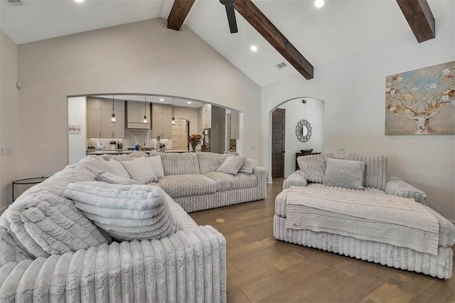 147 Butler Lake Dr, Saint Simons Island, GA 31522 - living area featuring arched walkways, beamed ceiling, a ceiling fan, high vaulted ceiling, and recessed lighting