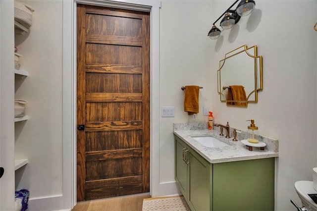 147 Butler Lake Dr, Saint Simons Island, GA 31522 - bathroom featuring vanity and wood finished floors
