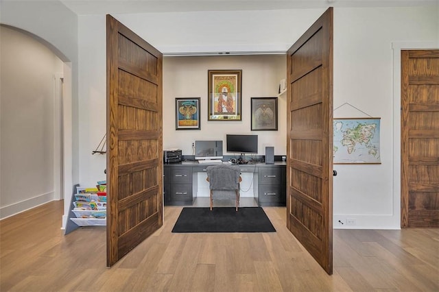 147 Butler Lake Dr, Saint Simons Island, GA 31522 - office area with arched walkways and light wood-style floors
