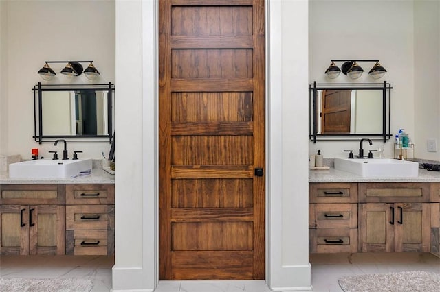 147 Butler Lake Dr, Saint Simons Island, GA 31522 - full bath featuring marble finish floors and two vanities