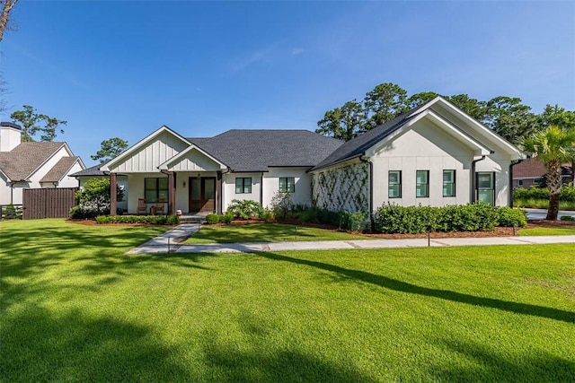 147 Butler Lake Dr, Saint Simons Island, GA 31522 - modern inspired farmhouse featuring a front yard and a porch