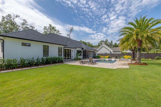 147 Butler Lake Dr, Saint Simons Island, GA 31522 - rear view of property featuring a patio area, a fenced backyard, french doors, and stucco siding