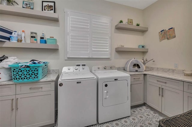 147 Butler Lake Dr, Saint Simons Island, GA 31522 - laundry area with washer and clothes dryer and cabinet space