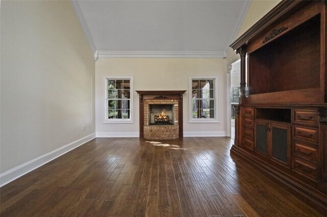 unfurnished living room featuring dark hardwood / wood-style floors, a brick fireplace, and ornamental molding