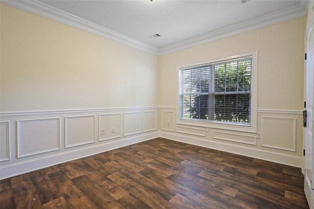 spare room with dark wood-type flooring and ornamental molding