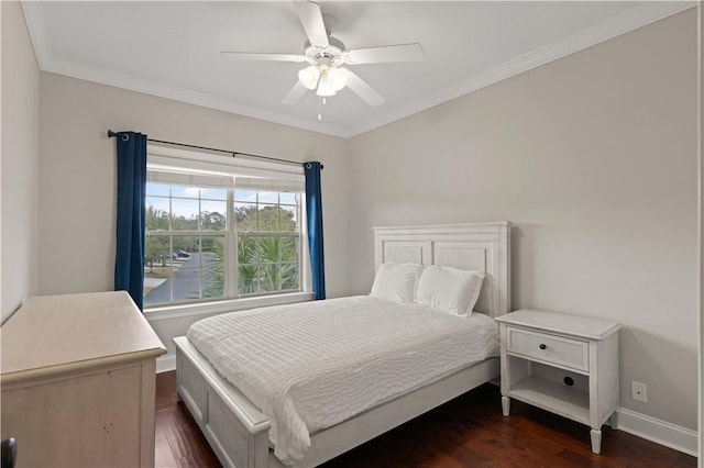 bedroom with dark wood-style floors, crown molding, baseboards, and a ceiling fan