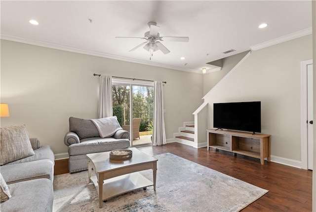 living area with baseboards, visible vents, dark wood finished floors, stairway, and ornamental molding