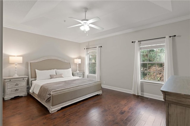 bedroom featuring dark wood-style floors, visible vents, ornamental molding, ceiling fan, and baseboards