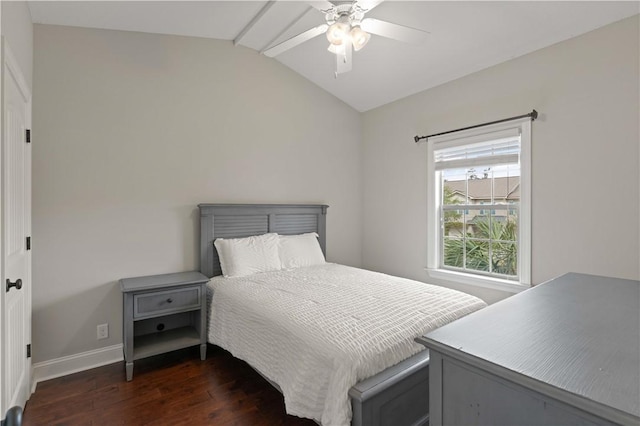 bedroom featuring dark wood-style floors, ceiling fan, lofted ceiling, and baseboards