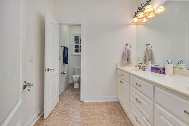 253 Winding Trl, Brunswick, GA 31523 - bathroom featuring double vanity and toilet