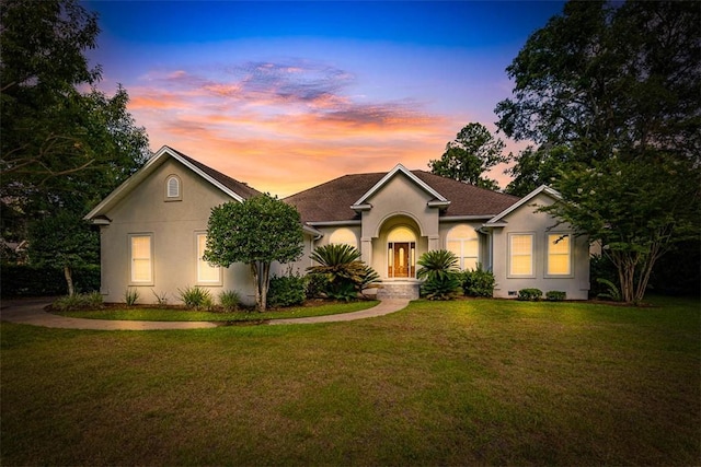253 Winding Trl, Brunswick, GA 31523 - single story home with stucco siding and a front yard