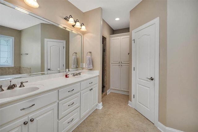 253 Winding Trl, Brunswick, GA 31523 - bathroom featuring double vanity, recessed lighting, tile patterned floors, and a shower with door