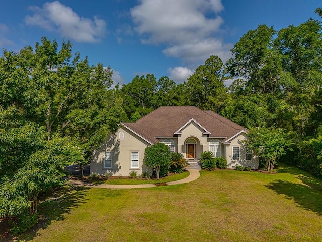 253 Winding Trl, Brunswick, GA 31523 - view of front of home featuring a front yard and stucco siding