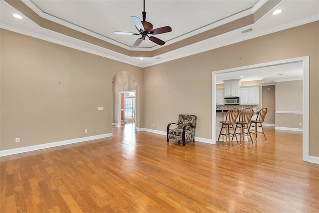253 Winding Trl, Brunswick, GA 31523 - unfurnished room featuring a raised ceiling, ceiling fan, light wood-type flooring, ornamental molding, and recessed lighting
