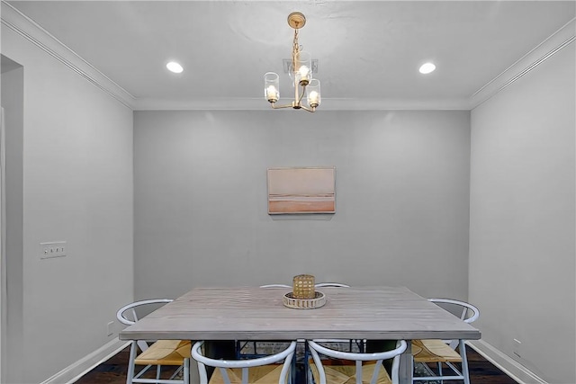 803 Mariners Cir, Saint Simons Island, GA 31522 - dining area with crown molding, baseboards, dark wood-type flooring, a chandelier, and recessed lighting