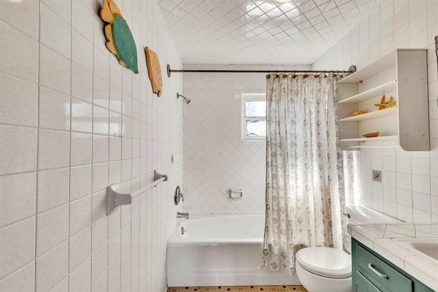 full bathroom with vanity, toilet, shower / bathtub combination with curtain, and tile walls