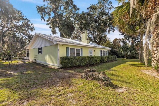 view of property exterior featuring a yard