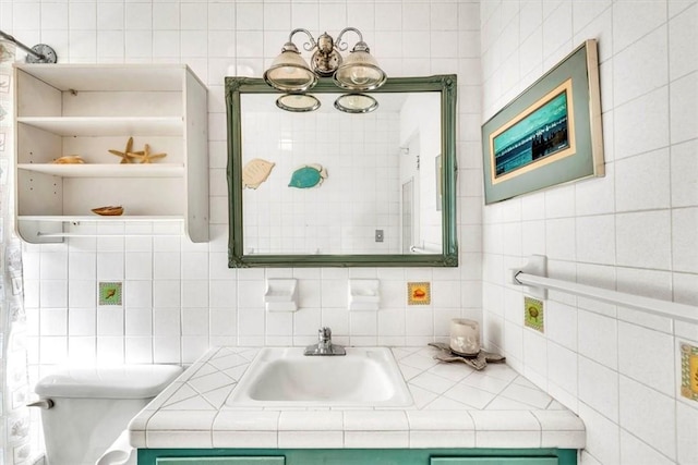 bathroom featuring decorative backsplash, vanity, tile walls, and toilet