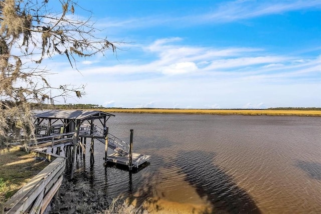 dock area with a water view