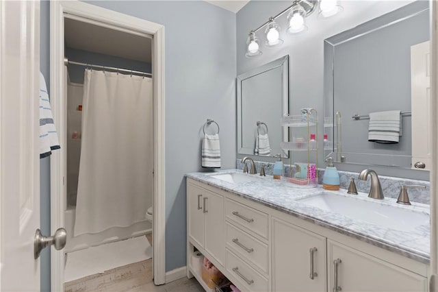 bathroom featuring vanity, hardwood / wood-style flooring, and toilet