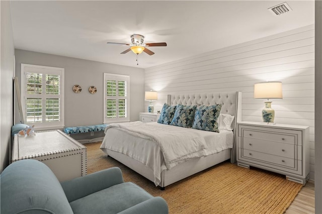 bedroom with light wood-type flooring and ceiling fan