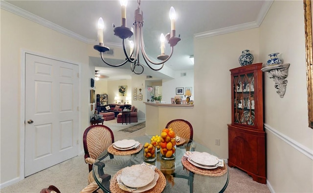 carpeted dining space with crown molding and a chandelier