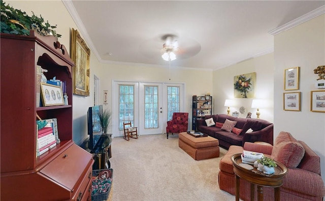 carpeted living room featuring ceiling fan and ornamental molding