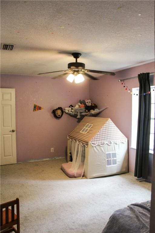 7535 Browntown Rd, Waynesville, GA 31566 - bedroom featuring a textured ceiling, carpet, and ceiling fan