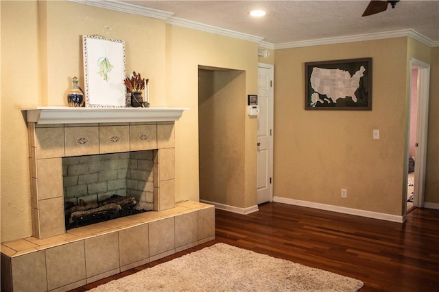 7535 Browntown Rd, Waynesville, GA 31566 - unfurnished living room featuring wood finished floors, ornamental molding, a tiled fireplace, baseboards, and a ceiling fan