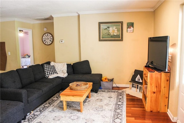 7535 Browntown Rd, Waynesville, GA 31566 - living area featuring wood finished floors, crown molding, baseboards, and ceiling fan