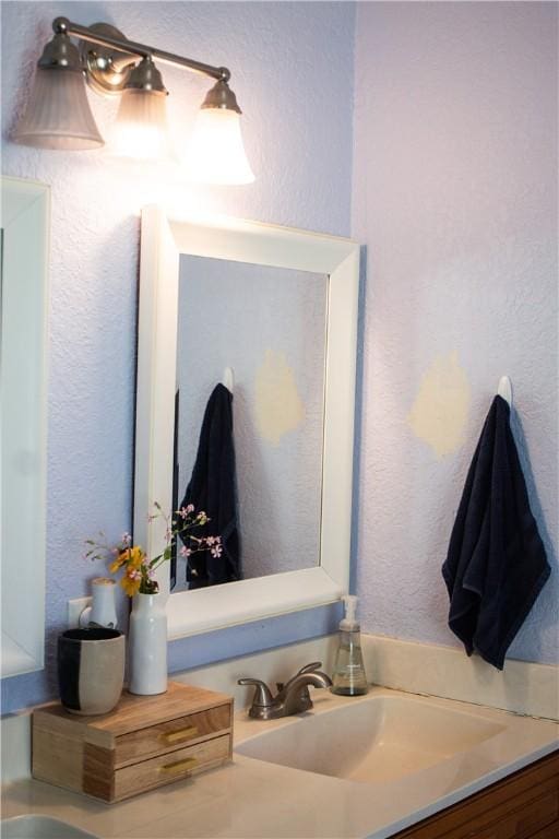 7535 Browntown Rd, Waynesville, GA 31566 - bathroom with a textured wall and vanity