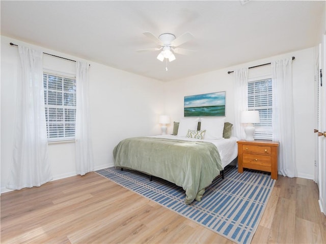 bedroom featuring ceiling fan and light wood-type flooring