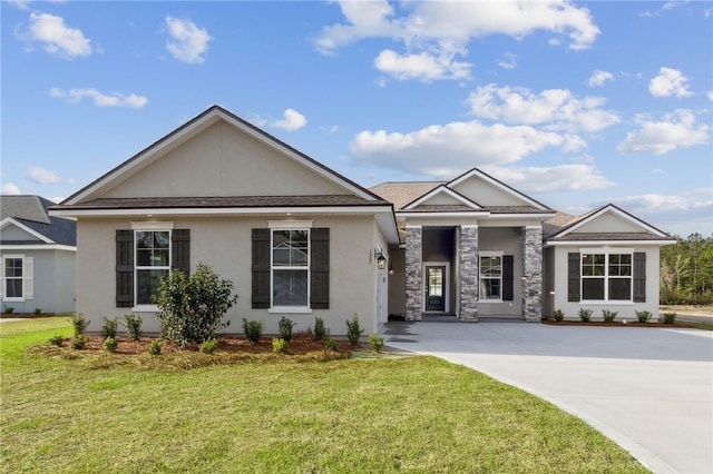 177 Verano St, Kingsland, GA 31548 - view of front facade with stucco siding, a front lawn, and concrete driveway